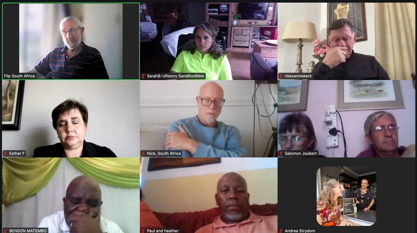 A screenshot of a video call with nine participants in a grid.