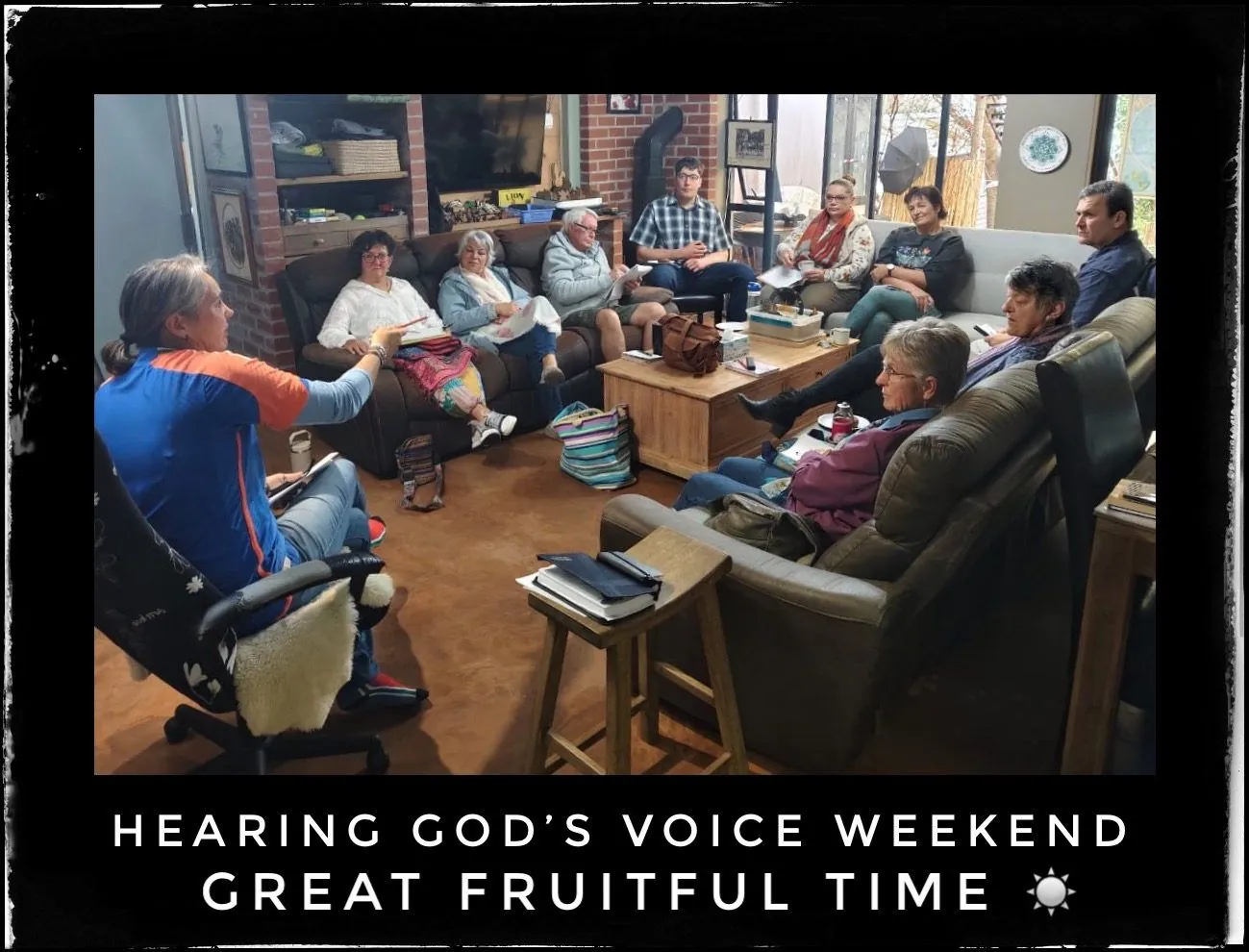 People sitting on sofas and chairs in a lounge, captioned Hearing God's voice weekend, great fruitful time.