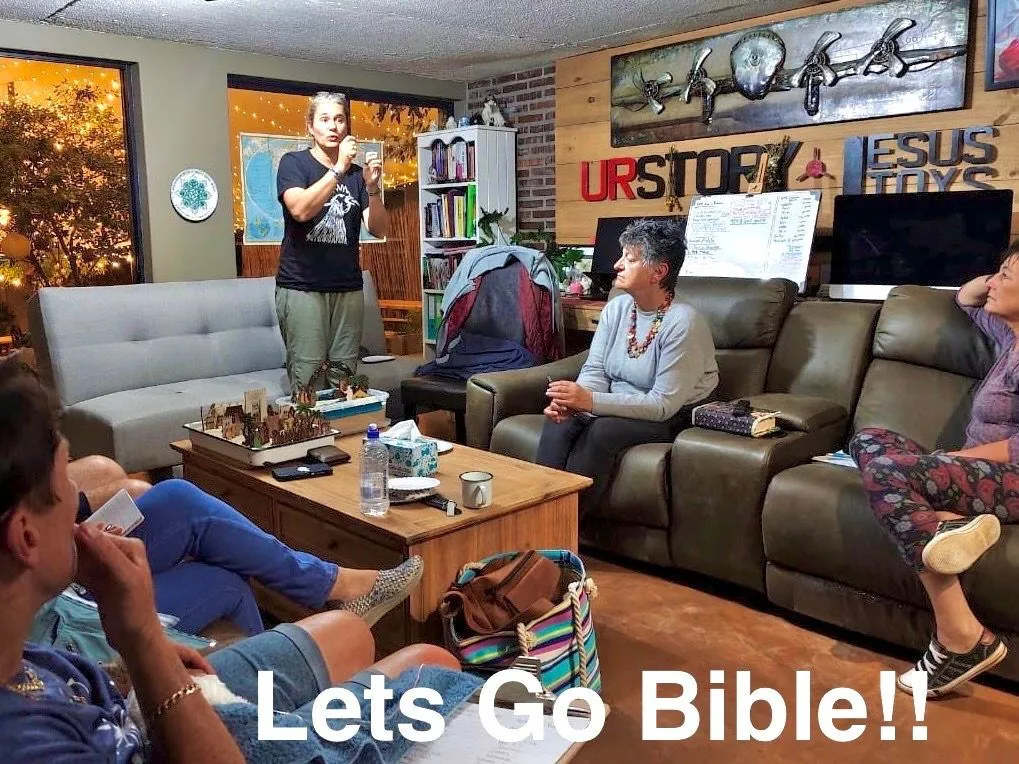A group of people sitting on sofas in a living room listening to a speaker, with the caption Lets Go Bible!!